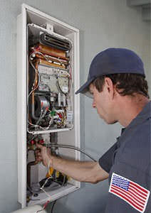 A technician installing a tankless water heater