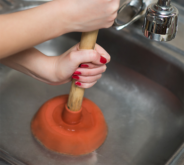 Orange County homeowner trying to unclog a drain